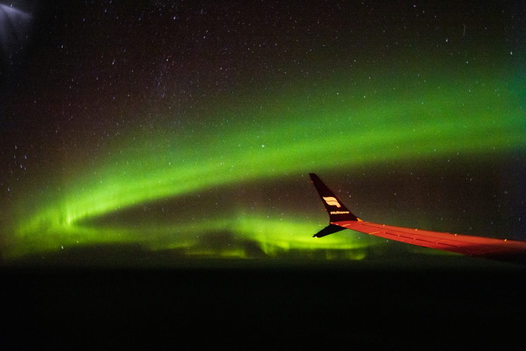 The Northern Lights from our airplane, 35,000 feet above the ocean.