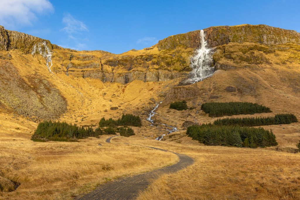 A quick but steep rock scramble leads hikers to the base of Bjarnarfoss, one of the most beautiful waterfalls I've ever seen. Very highly recommended.