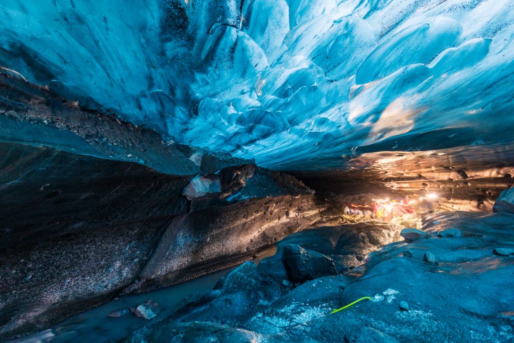 Some spelunkers returning to the mouth of the cave from deep inside.